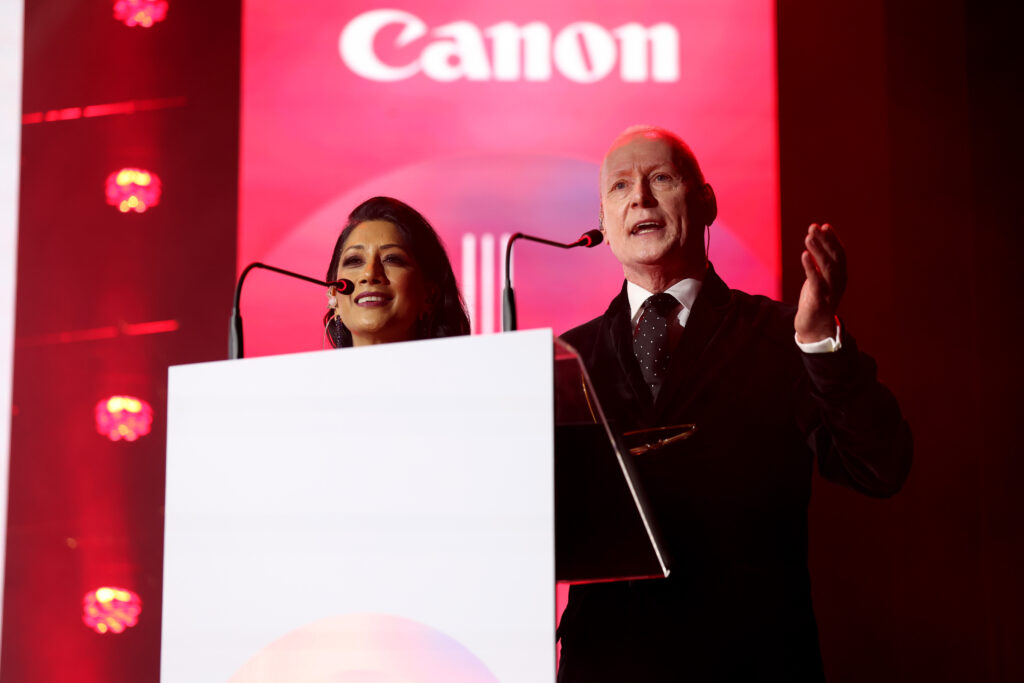 presenter at podium during corporate awards ceremony gala dinner