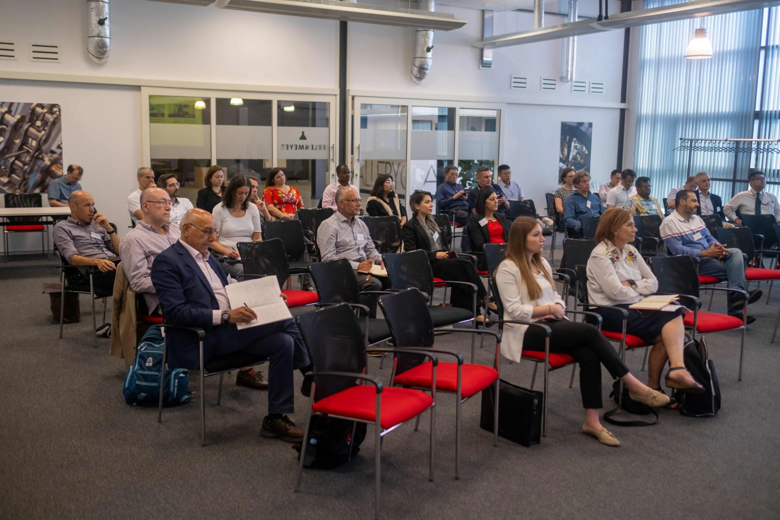 conference management checklist UK — international conference delegates in session