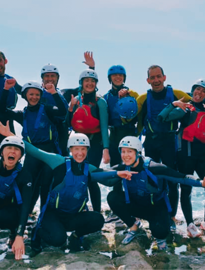 team building ideas for corporate events — group coasteering activity